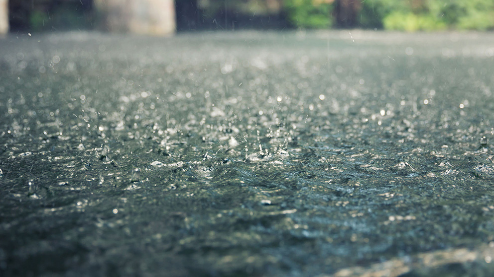 Rain falling on tarmac